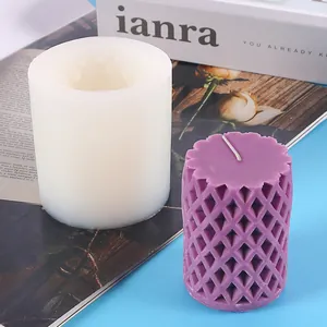 Detail of geometric silicone mold showing lattice pattern on a finished purple candle