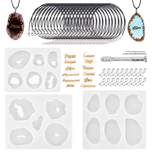 Comprehensive DIY resin pendant kit including silicone molds, zodiac charms, and tools.