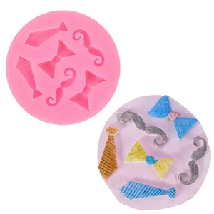 Pink silicone mold for cake decoration featuring necktie bowtie and mustache shapes