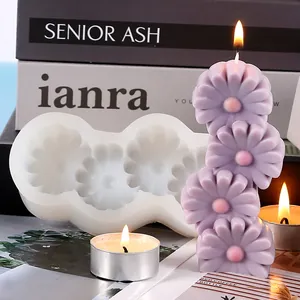 Close-up of flower shaped silicone mold and finished purple candle in a cozy setting