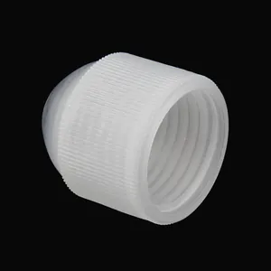 Detailed view of internal threads on a white plastic piping tip coupler for baking