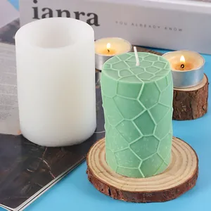 Geometric textured cylinder candle silicone mold shown with a finished green wax candle