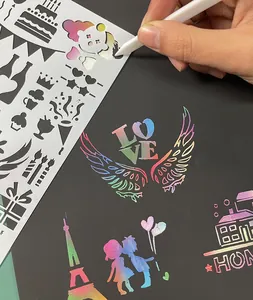 Close-up view of rainbow scratch art being created with creative DIY drawing stencil