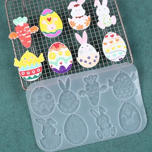 Vista dettagliata dello stampo in silicone a tema Pasqua con campioni in resina colorata