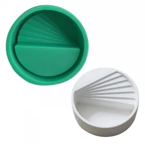 Detail view of green and white round silicone molds with unique staircase design