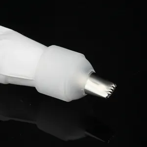 Detail view showing a stainless steel star piping tip with a translucent plastic coupler