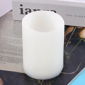 Detailed view of a white cylindrical silicone mold for DIY aroma candle and soap making.