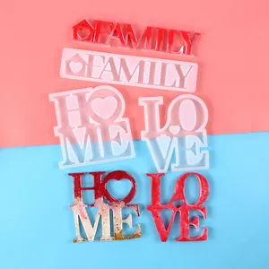Detailed view of DIY resin molds and finished Love Home Family letter ornaments