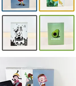 Detailed view of various cartoon A4 sketchbooks with cute panda and avocado covers
