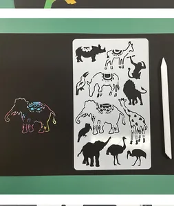Detailed view of animal painting stencils with a finished colorful scratch art elephant
