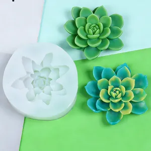 Detail of 3D succulent silicone mold with finished green and teal resin plants.