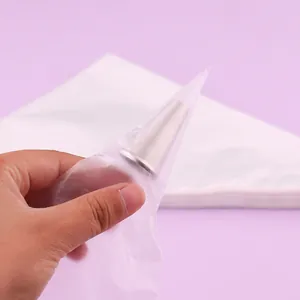 Close-up of a disposable PE piping bag with a stainless steel icing nozzle