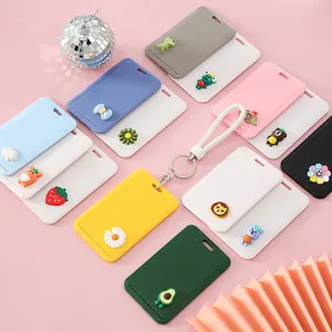 Cute cartoon push-pull ID card holders in multiple colors with wrist strap charms