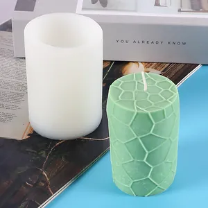 Cylindrical geometric silicone mold for DIY aromatherapy candle making with textured finish.