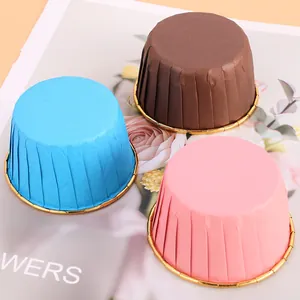 Close-up of blue pink and brown muffin cups featuring elegant gold rolled rims