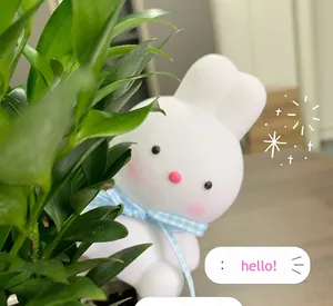 Cute rabbit-shaped LED night light with a blue checkered bow decoration