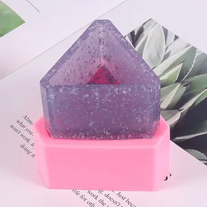Detailed macro view of hexagonal silicone mold with a purple resin geometric pot
