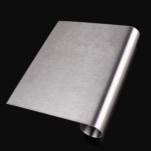Detailed macro view of professional brushed stainless steel dough scraper with rolled edge