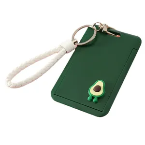 Green cartoon avocado ID card holder with a white braided wrist strap for students