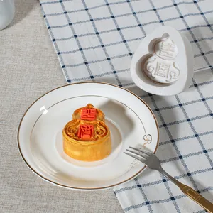 Detail of a gourd-shaped silicone mold with traditional Chinese auspicious characters.