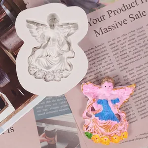 Angel silicone mold with finished colorful plaster figure for fondant and cake DIY crafts