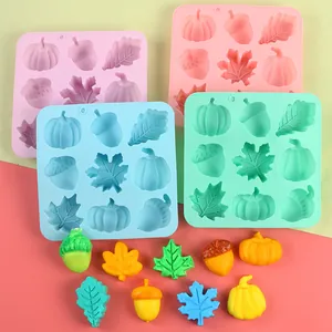 Close-up of silicone mold set with autumn shapes including pumpkin and maple leaf