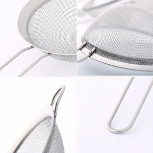 Close-up of fine stainless steel mesh and handle of a baking flour sieve