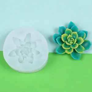 Detailed view of 3D succulent silicone mold beside a finished green and yellow resin plant