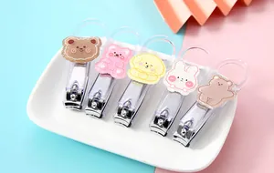 Set of portable nail clippers featuring five different cute cartoon animal stickers