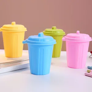 Mini desktop trash cans in colorful candy shades used as desk organizers and pen holders