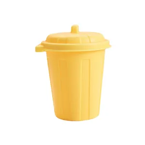 Miniature yellow plastic desktop trash can with lid for office storage and stationery pen holder