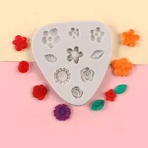 Detailed view of silicone mold with sunflower, rose, and leaf patterns for DIY cake decor