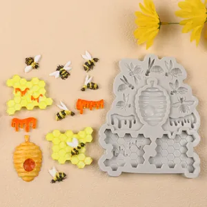 Detailweergave van de siliconen mal voor honingraat en bijen met fondant monsters