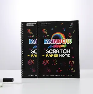 Close-up of rainbow scratch paper notebooks featuring spiral binding and vibrant covers