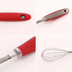 Dettagli ravvicinati della frusta in acciaio inox con manico in silicone rosso ergonomico