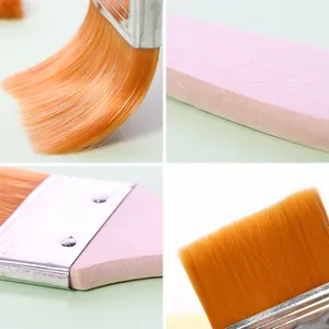 Macro details of soft nylon bristle BBQ brush with pink handle for baking and oiling.