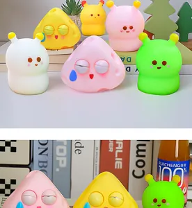 Detailed view of colorful cartoon eye-popping squeeze toys for stress relief.