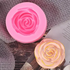 Detail view of pink rose silicone mold and a finished flower shape