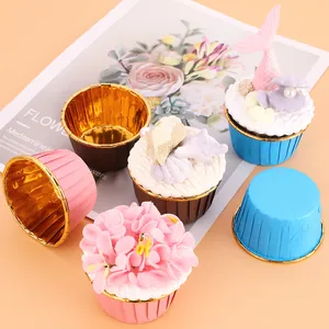 Greaseproof muffin liners with gold foil interior for baking colorful cupcakes
