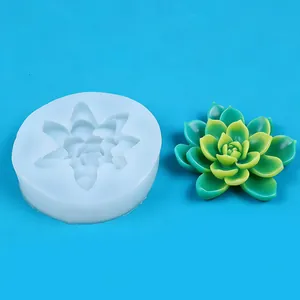Detail view of 3D succulent silicone mold with realistic finished resin plant on blue