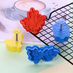 Set of 4 leaf-shaped cookie molds with spring-press handles for DIY baking craft
