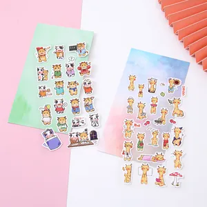 Vista detallada de pegatinas washi de vacas y jirafas de dibujos para scrapbooking