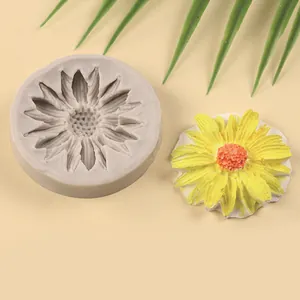 Detailed view of a sunflower silicone mold and its finished floral cake topper decoration