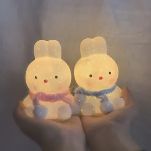 Cute rabbit LED night light for bedroom decor, warm glowing cartoon bedside lamp.
