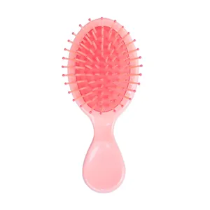 Kompakte rosa Mini-Haarbürste mit Luftkissenmassagefunktion für Mädchen, tragbar