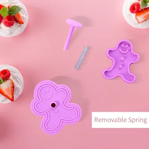Gingerbread man shaped spring-loaded cookie mold for DIY baking and fondant crafts