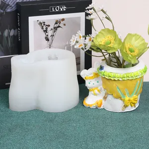 Detailed view of white silicone mold next to its finished rabbit-shaped planter pot.