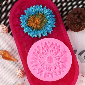 Detailed view of pink daisy sunflower silicone mold shown with finished resin flower