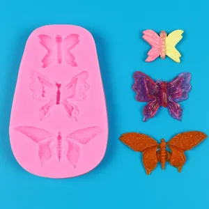 Detail view of pink butterfly silicone mold with colorful 3D butterfly finished pieces
