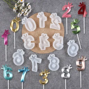 Detailed view of crown number silicone molds and colorful finished cake toppers